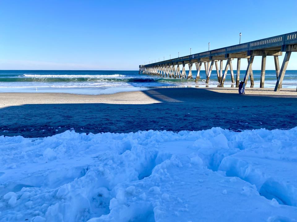 Wide sandy shoreline at Wrightsville Beach near Wilmington with calm Gulf Stream-influenced water, North Carolina